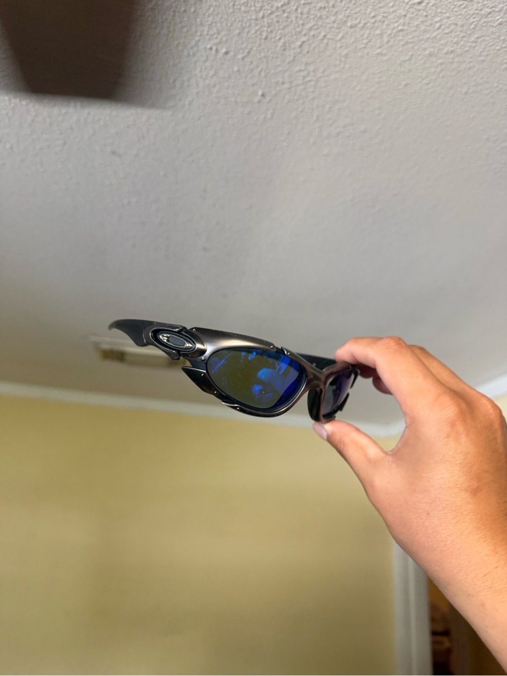 Oakley Black Frame Sunglasses with Blue Mirrored Lenses
